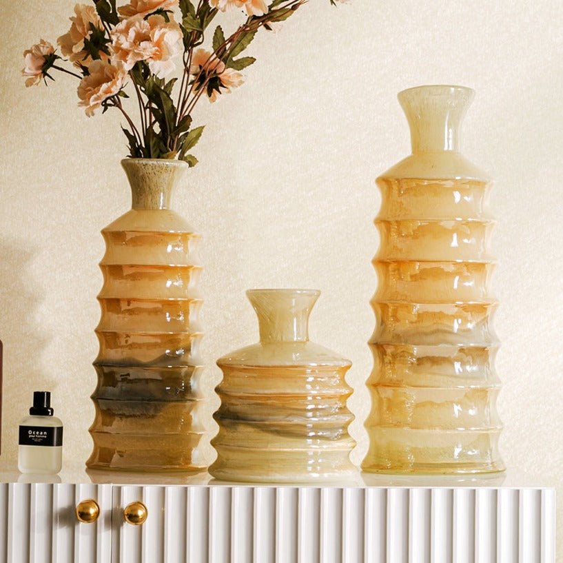 Beige Glass Vase Set - Versatile Elegance in Three Sizes Home Decor cabinet Sleek Contemporary Sophisticated Unique Elegant Decorative Trendy stylish Minimalist Artistic Luxury Designer tabletop table decor accessories tableware living room decor coffee table decor